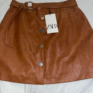 Selling mini faux skirt